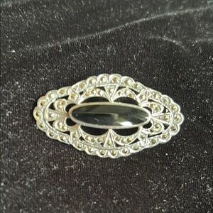 Intricate Silver and Black Filigree Brooch